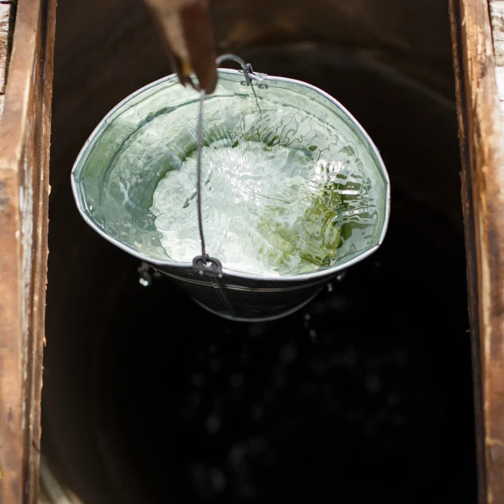 blue-bucked-inside-water-well-water-well-with-an-2025-02-12-05-35-07-utc